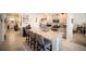Open-concept kitchen features granite countertops, stainless steel appliances, and breakfast bar seating at 3017 Country Club Cir, Winter Haven, FL 33881