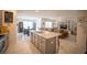 Open floor plan with a modern kitchen flowing into the dining and living areas at 3017 Country Club Cir, Winter Haven, FL 33881
