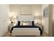 Serene bedroom featuring a comfortable bed, neutral colors, and stylish bedside lamps at 757 Terrapin Dr, Debary, FL 32713