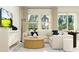 Bright living room featuring a sectional sofa, large windows, and contemporary décor at 757 Terrapin Dr, Debary, FL 32713