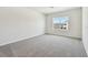 Carpeted bedroom with window to provide natural light at 16994 Cedar Valley Cir, Clermont, FL 34711