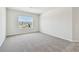 Carpeted bedroom featuring window for natural light at 16994 Cedar Valley Cir, Clermont, FL 34711