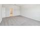 Bright bedroom with neutral carpet and access to a walk-in closet for ample storage at 16994 Cedar Valley Cir, Clermont, FL 34711