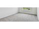 Carpeted bedroom with window for natural light at 16994 Cedar Valley Cir, Clermont, FL 34711
