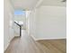 Bright entryway showcasing beautiful wood floors, stairway, and natural light at 16994 Cedar Valley Cir, Clermont, FL 34711