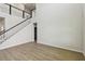 Large, open living space with soaring ceilings, staircase, and light, wood-look floors at 16994 Cedar Valley Cir, Clermont, FL 34711