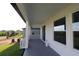 Covered outdoor patio offers backyard views and an ideal space for entertaining at 16994 Cedar Valley Cir, Clermont, FL 34711