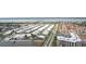 An aerial view showcasing a residential neighborhood with a glimpse of the coastal waters in the background at 2625 S Atlantic Ave # 24Sw, Daytona Beach, FL 32118