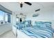 Shared bedroom with twin beds, beachfront decor, and a mirrored closet at 2625 S Atlantic Ave # 24Sw, Daytona Beach, FL 32118