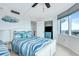 Shared bedroom with white walls, twin beds and a view of the city at 2625 S Atlantic Ave # 24Sw, Daytona Beach, FL 32118