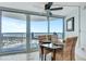 Bright dining area with modern table and seating and a spectacular view of the ocean at 2625 S Atlantic Ave # 24Sw, Daytona Beach, FL 32118