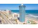 Stunning exterior view of the beachfront condominium tower with ocean views and surrounding city buildings at 2625 S Atlantic Ave # 24Sw, Daytona Beach, FL 32118