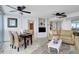 Comfortable living and dining area with beige colored sofas and a flatscreen tv at 2625 S Atlantic Ave # 24Sw, Daytona Beach, FL 32118
