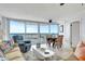 Bright living room with a large windows offering stunning ocean views and comfortable seating at 2625 S Atlantic Ave # 24Sw, Daytona Beach, FL 32118