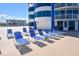 Plenty of lounge chairs await poolside at this condo complex at 2625 S Atlantic Ave # 24Sw, Daytona Beach, FL 32118