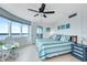 Bright main bedroom with coastal decor, ocean view, and comfortable blue and green bedding at 2625 S Atlantic Ave # 24Sw, Daytona Beach, FL 32118
