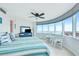 Bright main bedroom featuring floor-to-ceiling windows with blinds and coastal decor at 2625 S Atlantic Ave # 24Sw, Daytona Beach, FL 32118