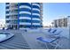 Pool deck with lounge chairs overlooking the beach and ocean at 2625 S Atlantic Ave # 24Sw, Daytona Beach, FL 32118