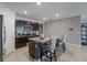 Well-equipped kitchen featuring granite countertops, a center island with seating, and stainless steel appliances at 9532 Black Walnut Dr, Clermont, FL 34715
