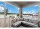 Relaxing screened patio featuring comfortable gray seating and views of the community at 9532 Black Walnut Dr, Clermont, FL 34715