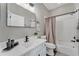 Bathroom featuring white vanity with matte black faucet and framed mirror at 1530 The Oaks Blvd, Kissimmee, FL 34746