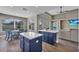 This open kitchen with eat in dining area boasts granite counters, stainless steel appliance, and custom cabinetry at 1530 The Oaks Blvd, Kissimmee, FL 34746