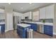 Well lit kitchen features granite counters, stainless steel appliances, and ample cabinet space at 1530 The Oaks Blvd, Kissimmee, FL 34746