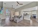 Spacious open-concept living area with wood floors, leading to dining and kitchen areas at 1530 The Oaks Blvd, Kissimmee, FL 34746