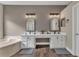 Main bathroom featuring a double vanity, lots of storage, and modern fixtures at 1530 The Oaks Blvd, Kissimmee, FL 34746