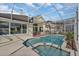 Enjoy this screened in pool and spa for seamless indoor/outdoor living at 1530 The Oaks Blvd, Kissimmee, FL 34746