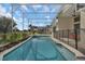 Relaxing screened-in pool and spa with manicured landscaping, perfect for outdoor enjoyment at 1530 The Oaks Blvd, Kissimmee, FL 34746