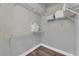 Bright walk-in closet featuring wire shelving, ideal for organized storage at 1530 The Oaks Blvd, Kissimmee, FL 34746