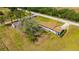 A sprawling yard surrounds this cozy single-story home with the storage building in the back at 2425 Anderson, Mulberry, FL 33860