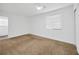 Bedroom with neutral carpet, white walls, a ceiling fan, and natural light from a window at 2425 Anderson, Mulberry, FL 33860
