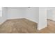 Spacious living room with beige carpet and neutral paint, ready for your personal touches at 2425 Anderson, Mulberry, FL 33860
