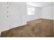 Bright living room with a window, carpet and fresh white walls at 2425 Anderson, Mulberry, FL 33860