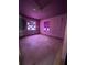 Pink bedroom featuring stained glass windows and visible signs of wear and tear; renovation needed at 2610 Tennessee Rd, Lakeland, FL 33815
