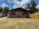 Charming single-story home with brick facade and unique window decorations at 2610 Tennessee Rd, Lakeland, FL 33815