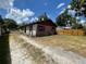 Single-story home featuring a brick facade and a spacious front yard at 2610 Tennessee Rd, Lakeland, FL 33815
