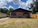Charming single-story home with brick facade and unique window decorations at 2610 Tennessee Rd, Lakeland, FL 33815