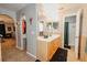 Bathroom with double sinks, arched doorway, and a separate shower at 1808 Ashton E Dr, St Cloud, FL 34771