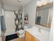 Bathroom featuring a shower-tub combo and vanity with a framed mirror at 1808 Ashton E Dr, St Cloud, FL 34771