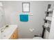 Well-lit bathroom featuring a wood vanity, vessel sink, and modern fixtures at 1808 Ashton E Dr, St Cloud, FL 34771