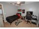 Cozy bedroom showcasing neutral walls, plush carpet, and a gaming space at 1808 Ashton E Dr, St Cloud, FL 34771