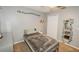 Cozy bedroom with neutral tones, decorated with hanging vines and minimalist decor at 1808 Ashton E Dr, St Cloud, FL 34771