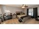A serene bedroom featuring a neutral color palette, a wood-frame bed, and an eye-catching neon decorative sign at 1808 Ashton E Dr, St Cloud, FL 34771