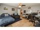 Spacious bedroom with neutral paint, complete with comfortable seating, and ample desk space for work or study at 1808 Ashton E Dr, St Cloud, FL 34771