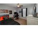 Bedroom with modern gamer-themed decor, a dark color scheme, and a comfortable gaming chair at 1808 Ashton E Dr, St Cloud, FL 34771