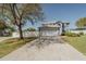 Well-maintained two-story home with a spacious driveway, a two-car garage, and mature landscaping at 1808 Ashton E Dr, St Cloud, FL 34771