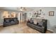 Spacious living room with arched doorways, tile flooring, and comfortable seating arrangement at 1808 Ashton E Dr, St Cloud, FL 34771